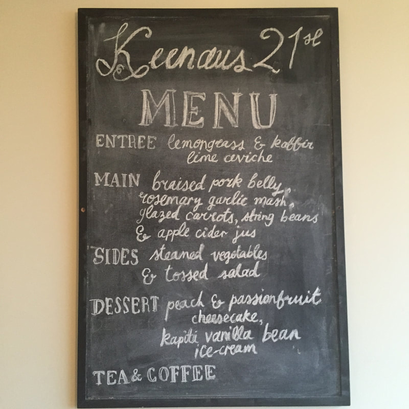 A menu chalkboard written specific to this event
